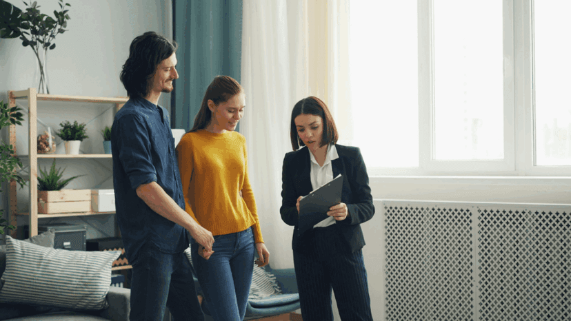 Homeowners reviewing property tax documents with consultant