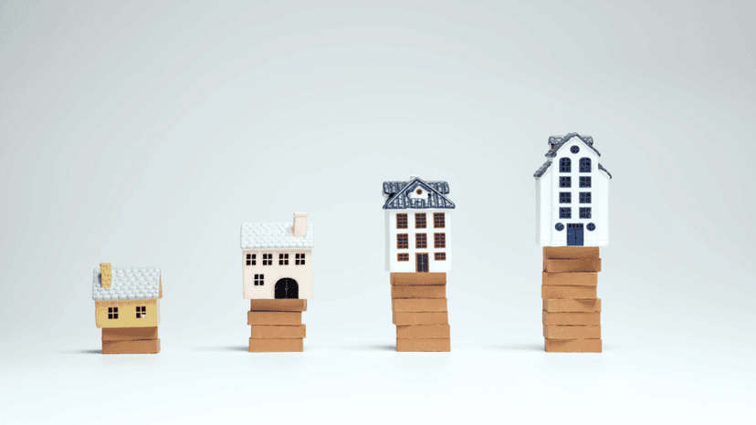 Miniature houses symbolizing growth of real estate market