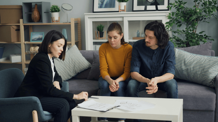 Couple conversing with tax expert regarding their partnership