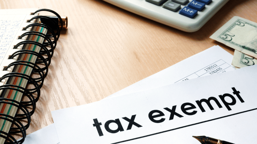 Property tax exemption paperwork on a desk with financial documents
