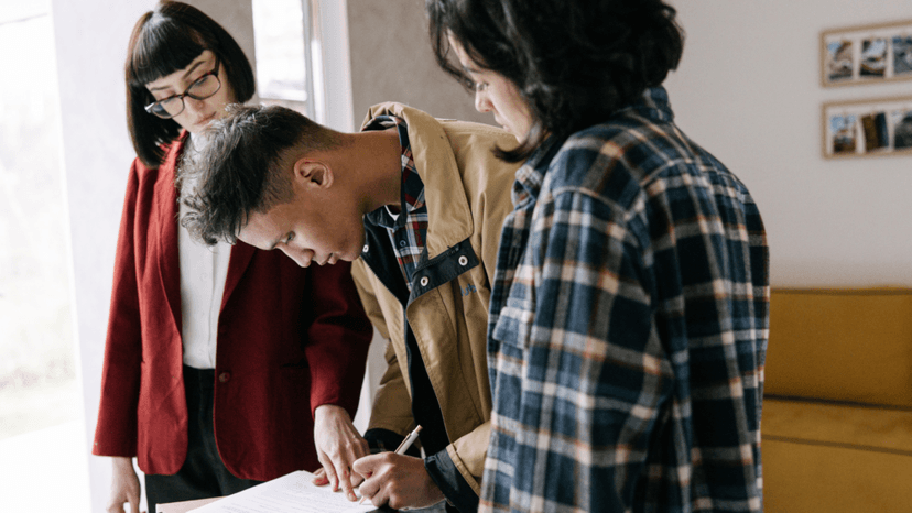 Buyer signing prorated property tax terms in a real estate contract