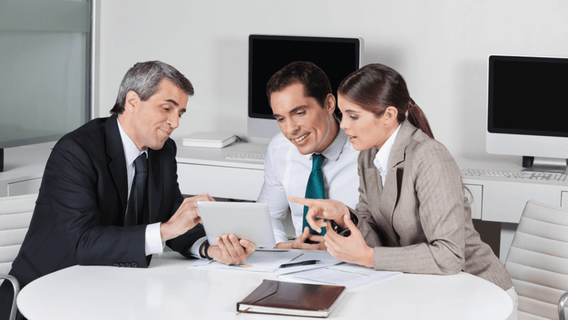 Consultant explaining BPP filing requirements to a business client