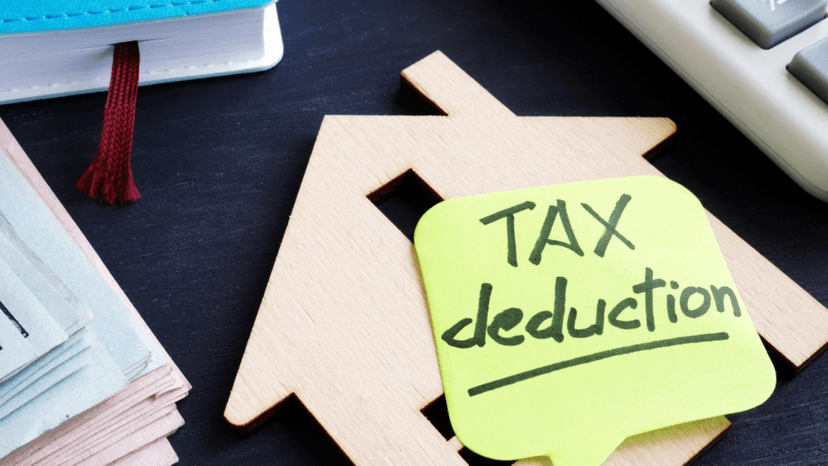 House-shaped figure paired with a tax deduction reminder note