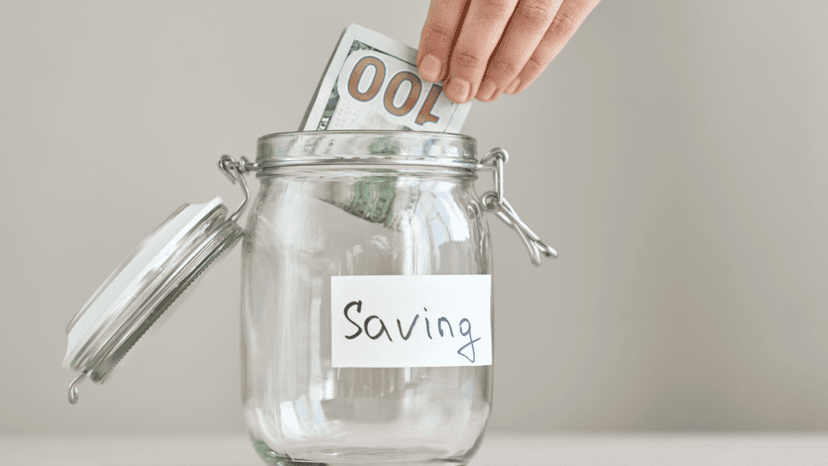 Savings jar with cash showing property tax reduction benefits