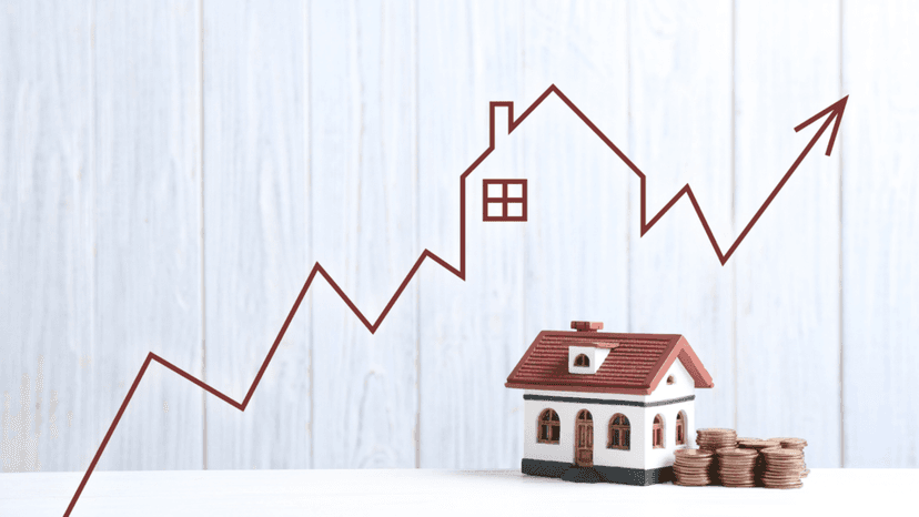 Upward trend graph and home model representing rising assessed value