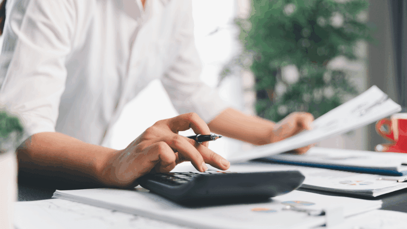 Tax adviser calculating taxes for her client’s application of tax exemptions