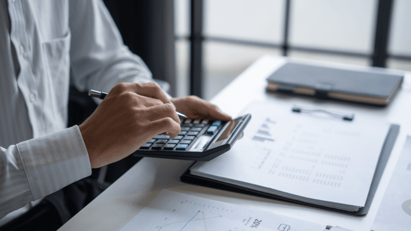 Consultant reviewing financial documents to assess capital loss tax offset options