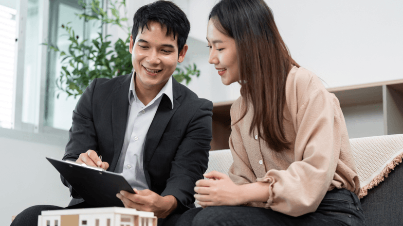 A property tax consultant reviewing documents with a business property owner