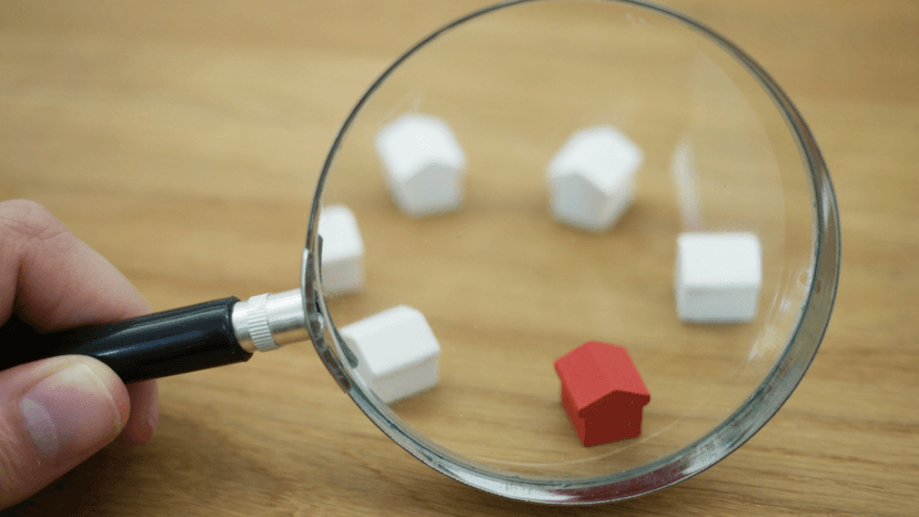 Close review of miniature homes representing property valuation date assessment