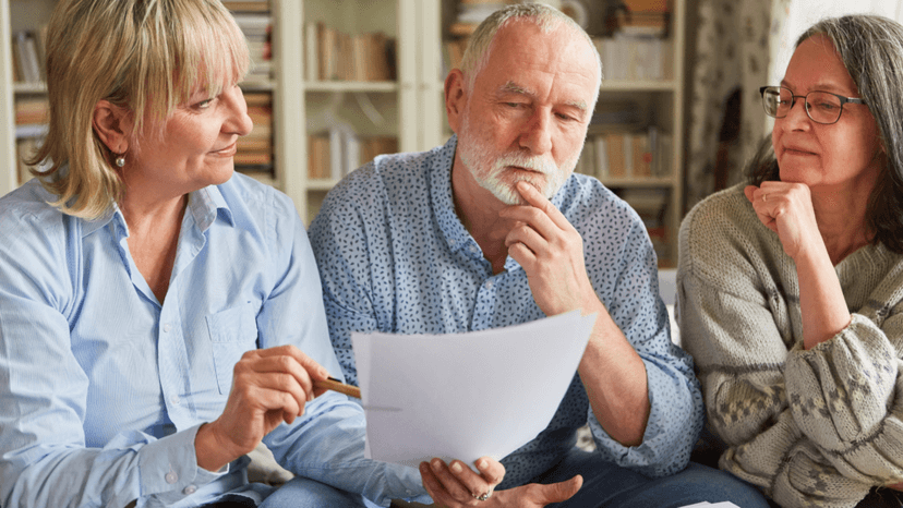 Elderly homeowners discussing Texas senior property tax exemption benefits