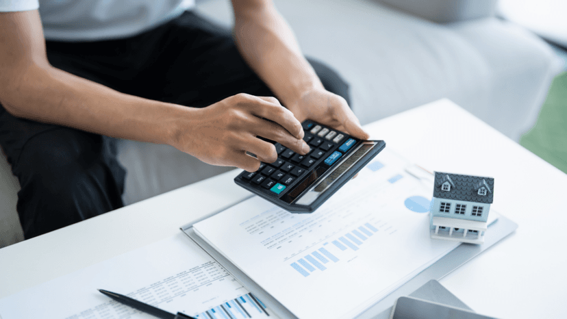 Homeowner calculating property tax assessment figures to prepare a formal protest