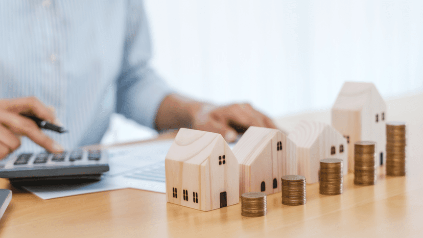 House models with stacked coins representing Texas property tax assessment and protest grounds