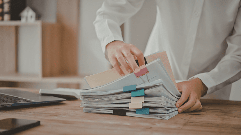 Person organizing property tax documents to file with appraisal district