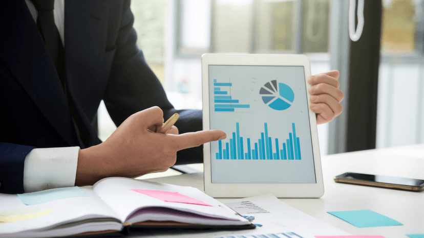 Professional analyzing financial charts used in income capitalization appraisal method