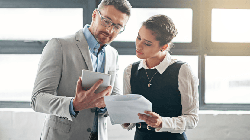 Property tax consultants reviewing benchmark data for similar business asset assessments