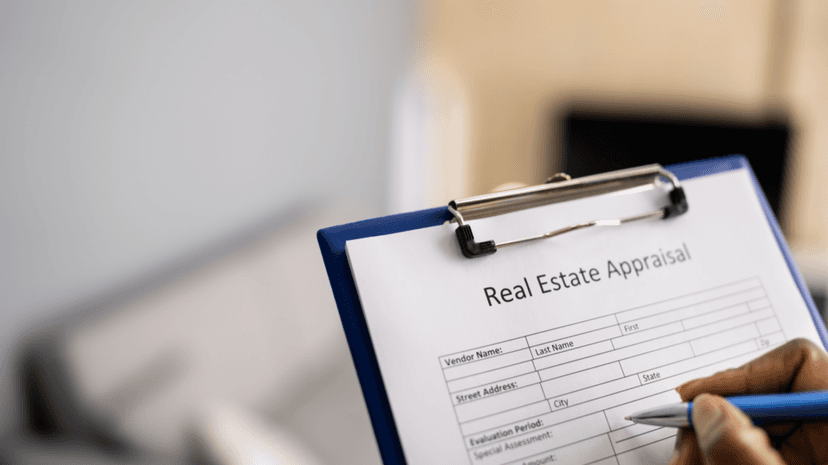 Real estate appraisal form being completed on clipboard