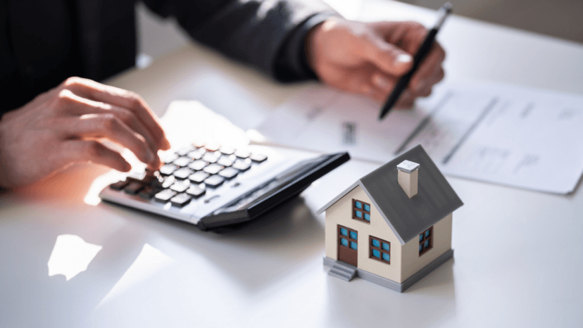 Tax consultant reviewing client_s appraisal paperwork and calculating a property tax rate